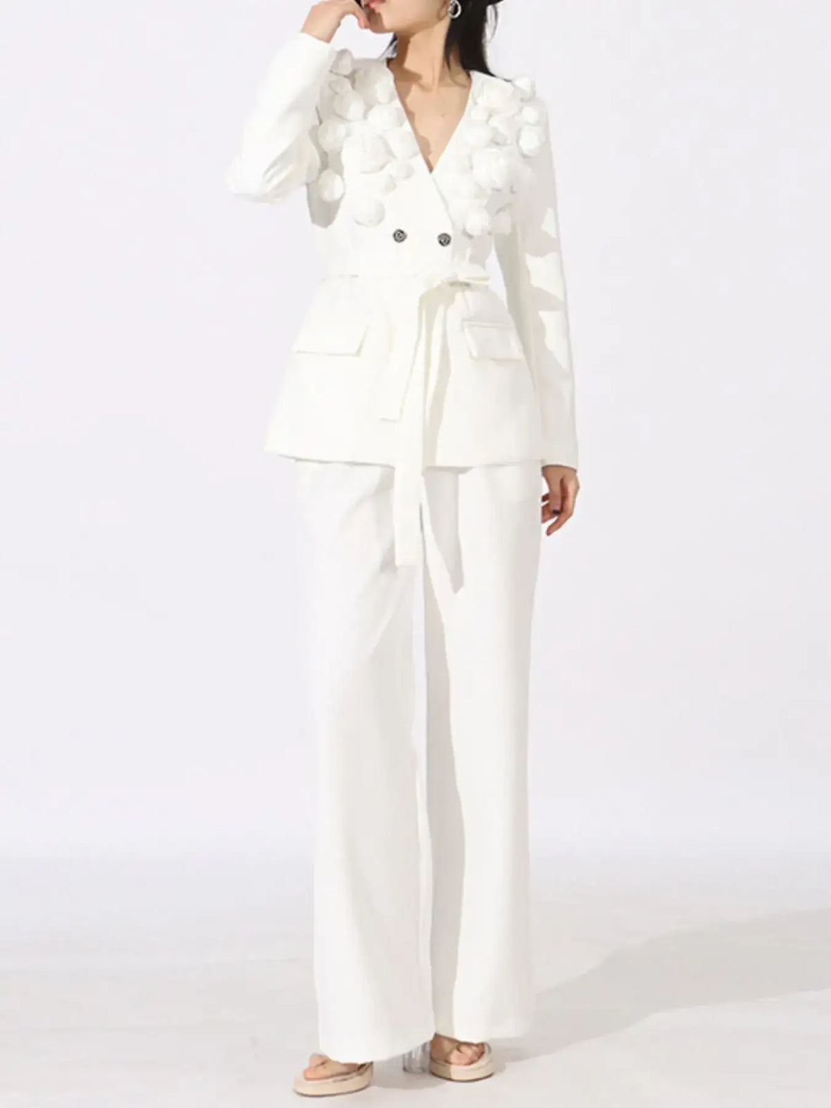 Evie's Dreamland white double-breasted blazer with 3D flower accents and matching wide-leg pants.