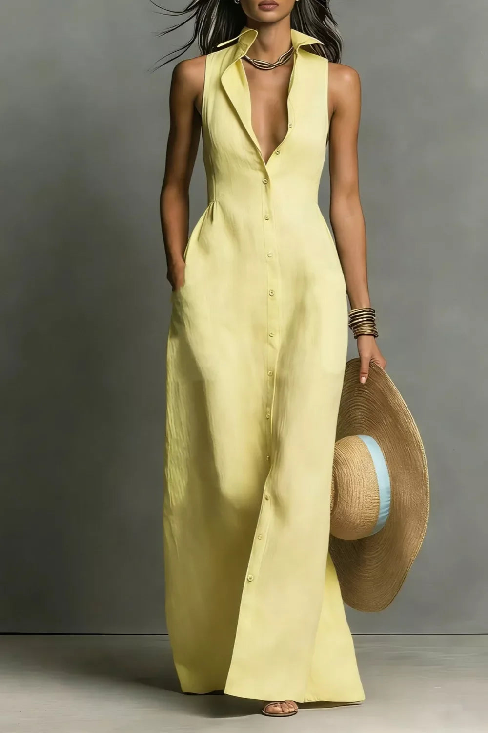 Yellow sleeveless button-front maxi dress with collar, paired with straw hat and sandals for summer elegance.