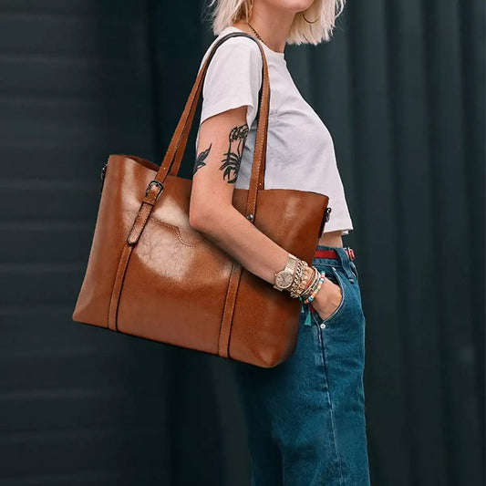 Brown PU leather large tote bag by Evie's Dreamland, styled with a white t-shirt and denim jeans.