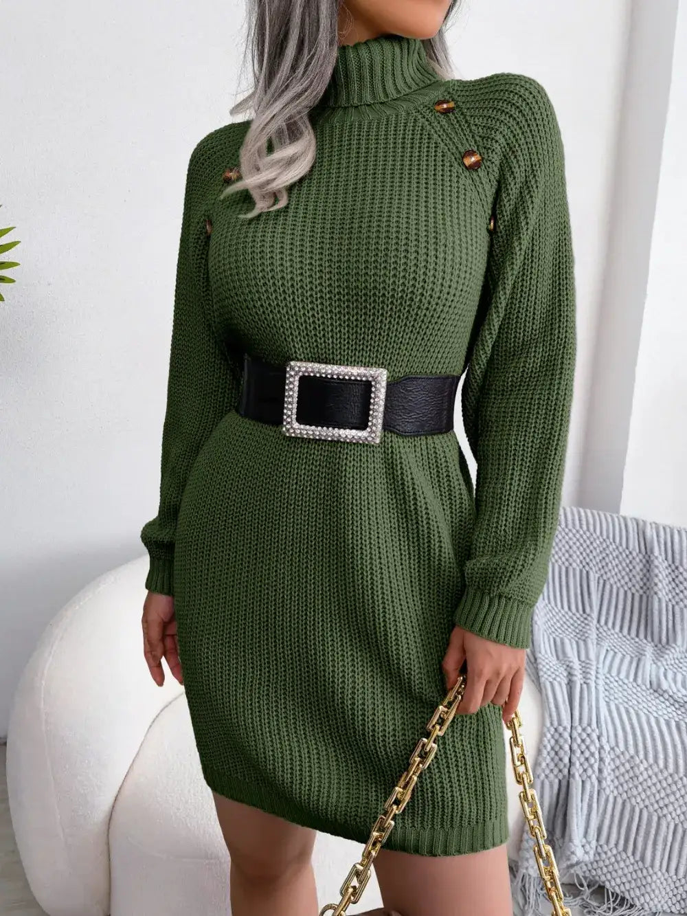 Olive green knit turtleneck sweater dress by Evie's Dreamland with shoulder buttons and a black belted waist.