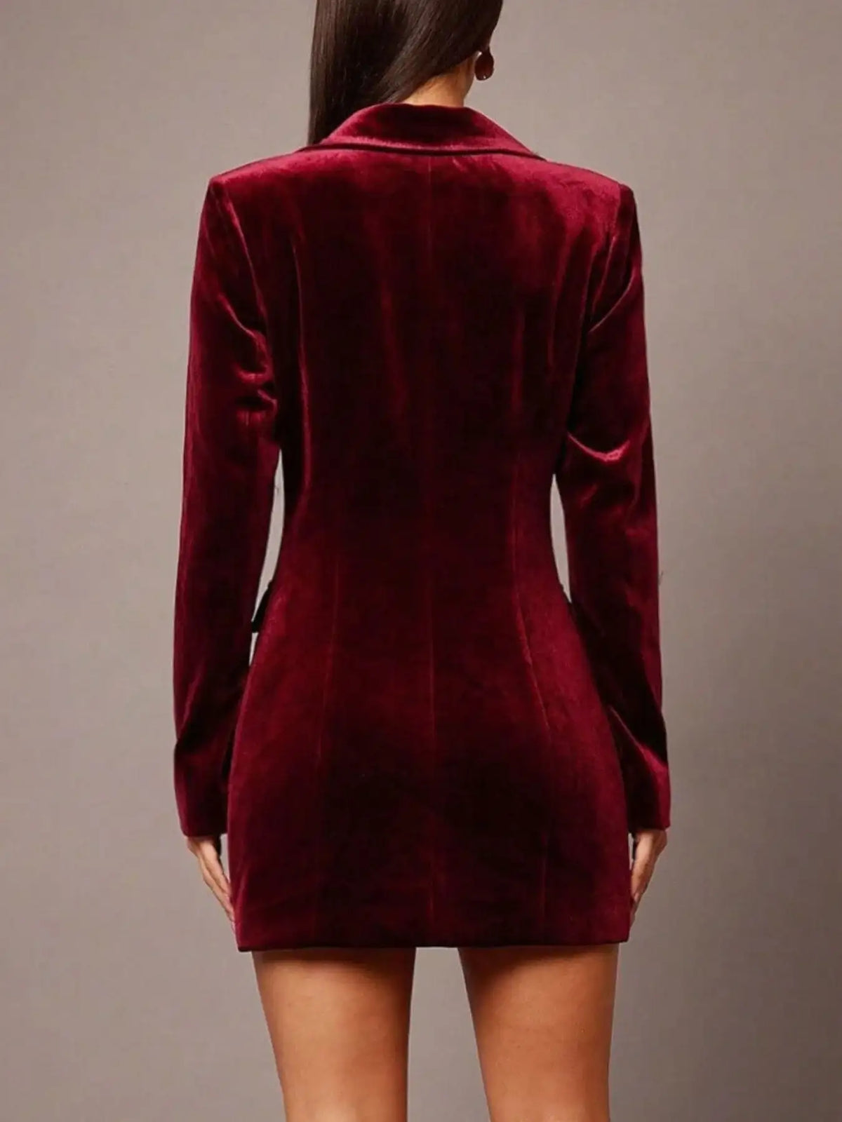 Back view of a burgundy velvet blazer dress by Evie's Dreamland with long sleeves and a tailored fit.