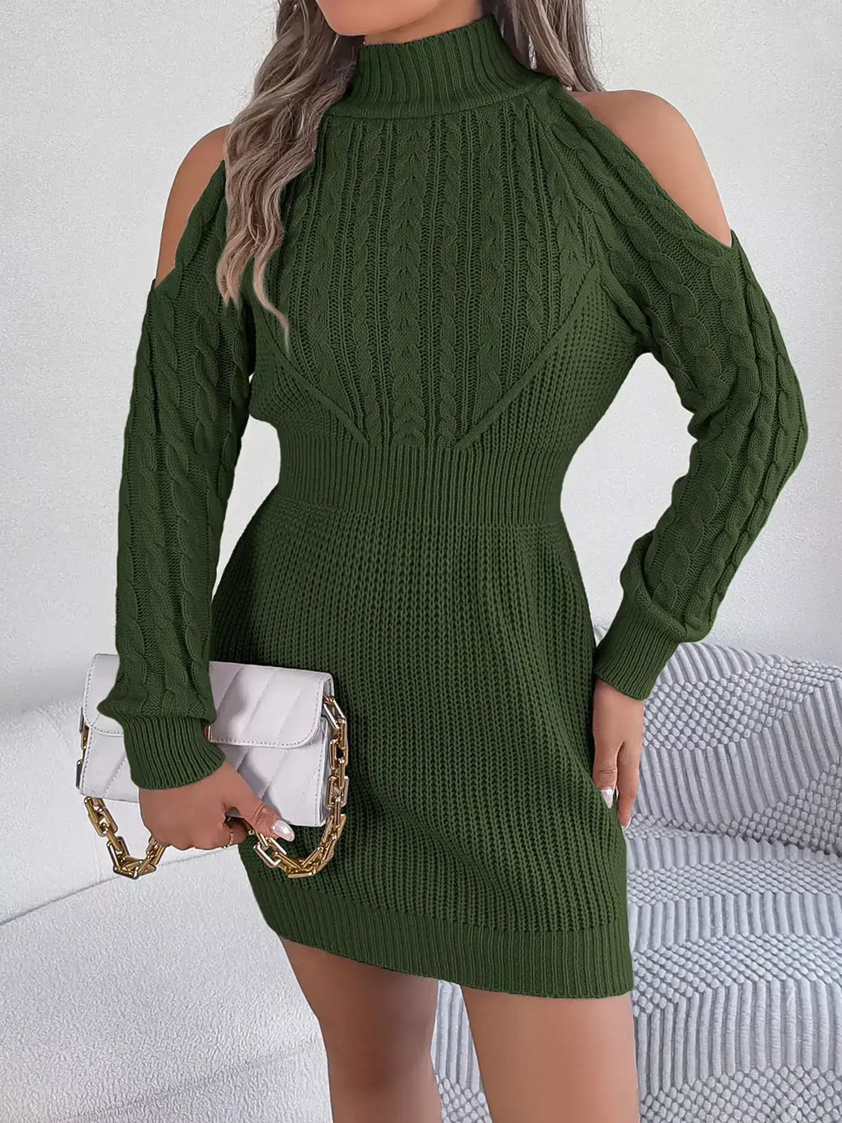 Olive green cold shoulder cable knit turtleneck sweater dress by Evie's Dreamland with white handbag.