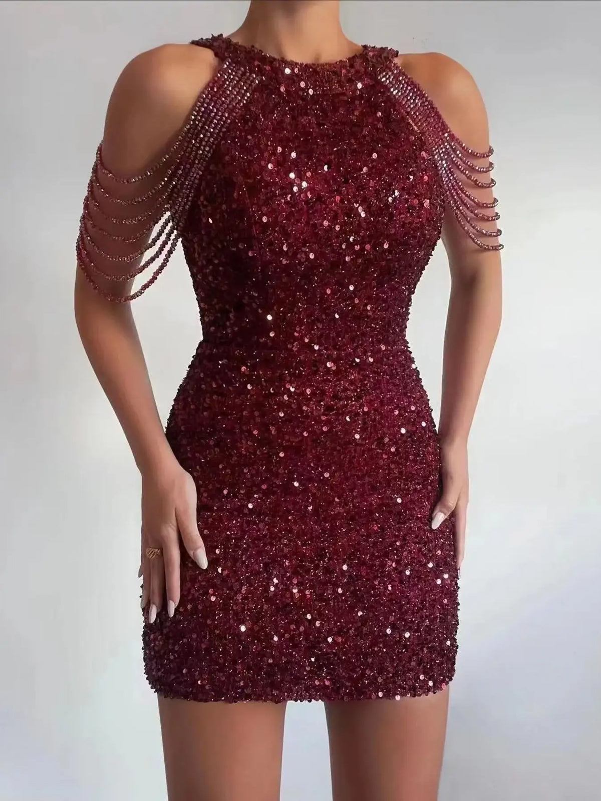 Evie's Dreamland burgundy sequin bodycon mini dress with cold shoulder beaded fringe sleeves.