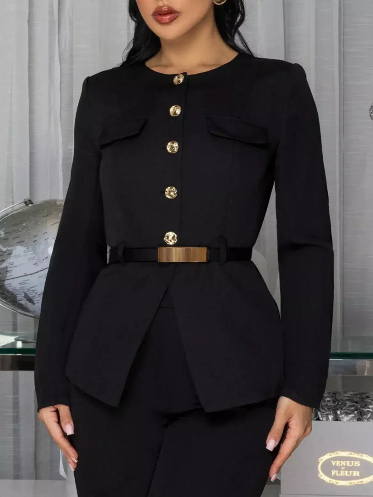 Evie's Dreamland black long sleeve button-up top with gold buttons and a belted waist.