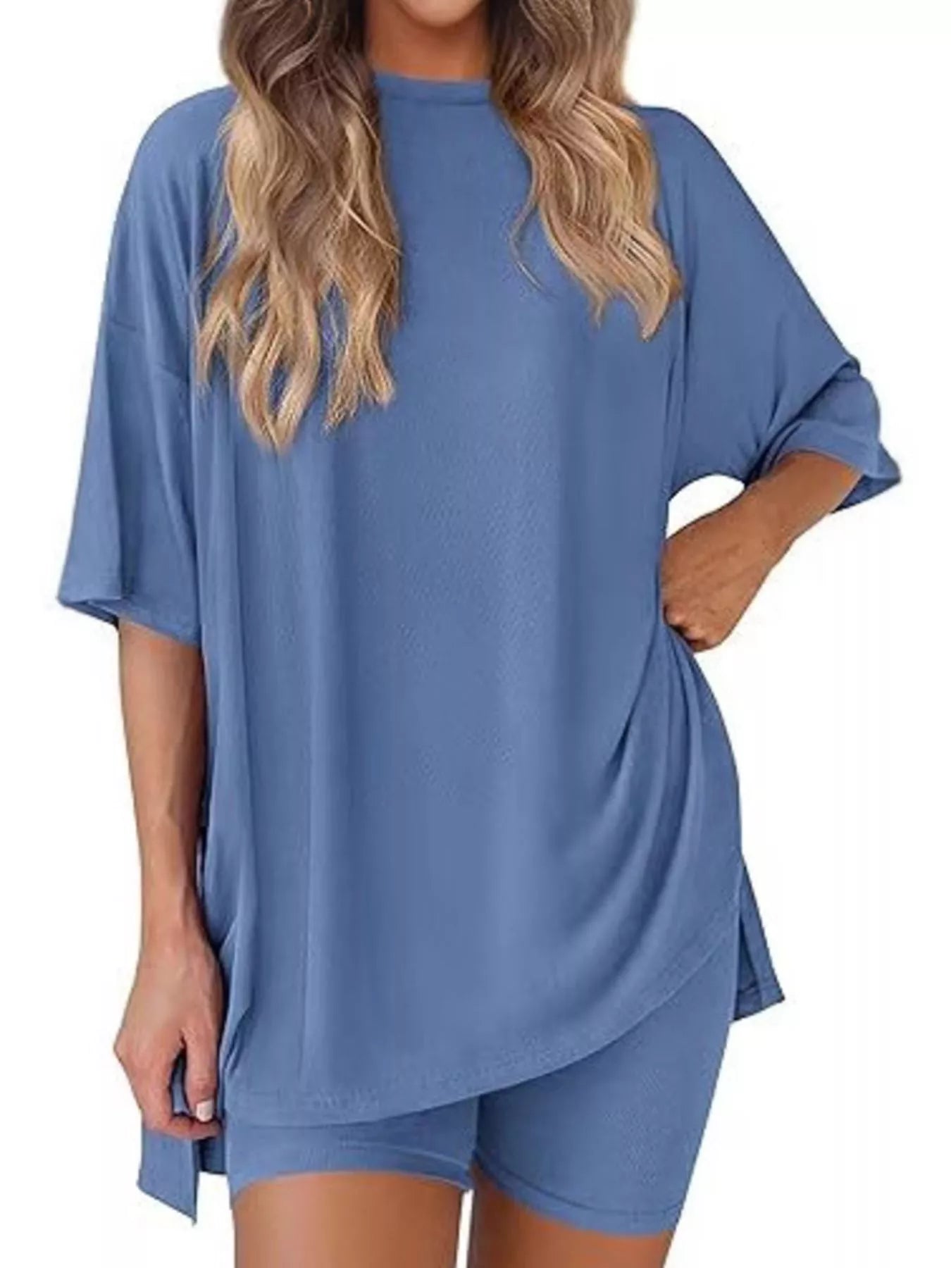 Woman wearing a loose blue lounge set with oversized top and matching shorts