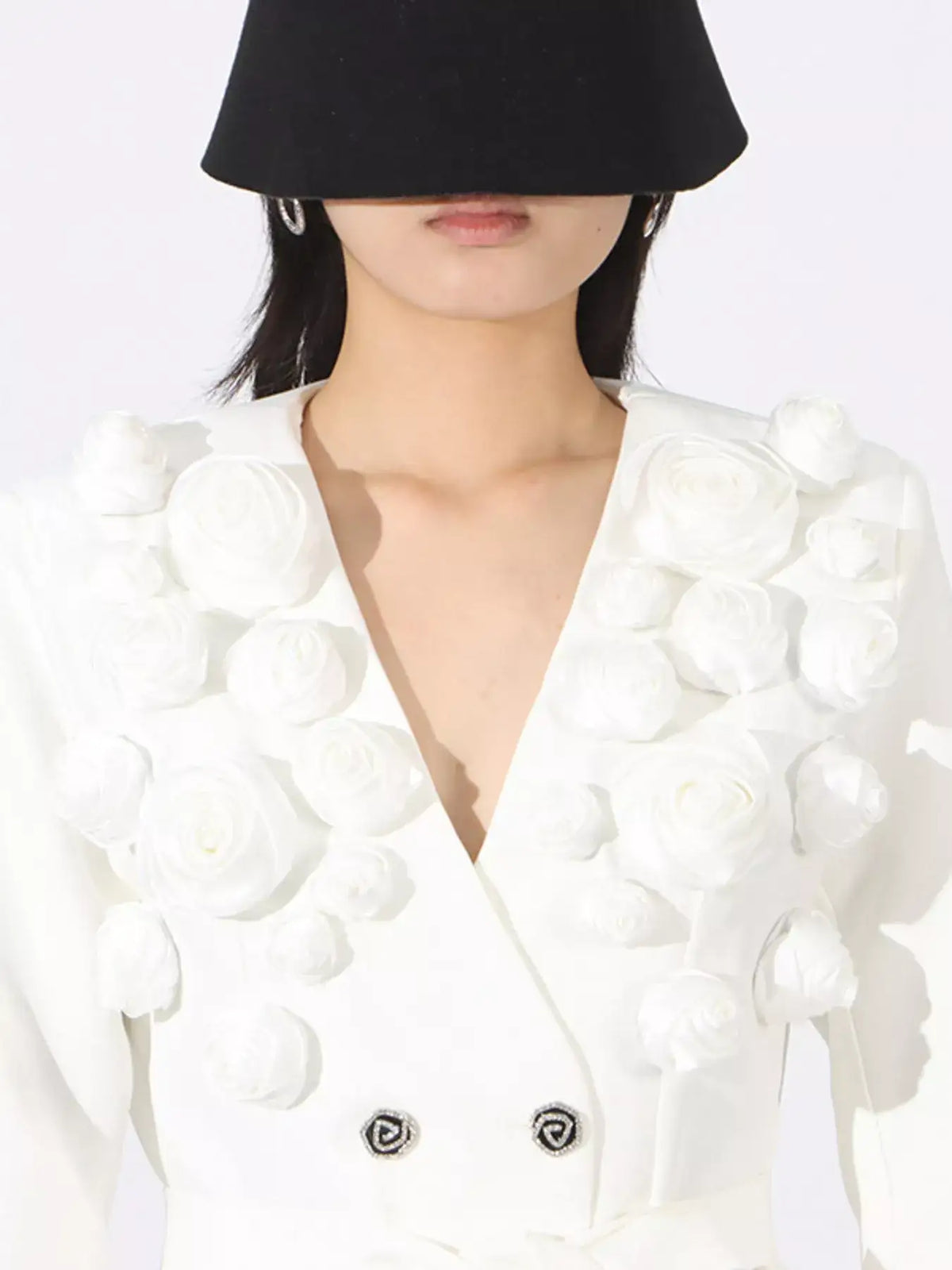 White double-breasted blazer by Evie's Dreamland featuring 3D floral applique and decorative buttons.