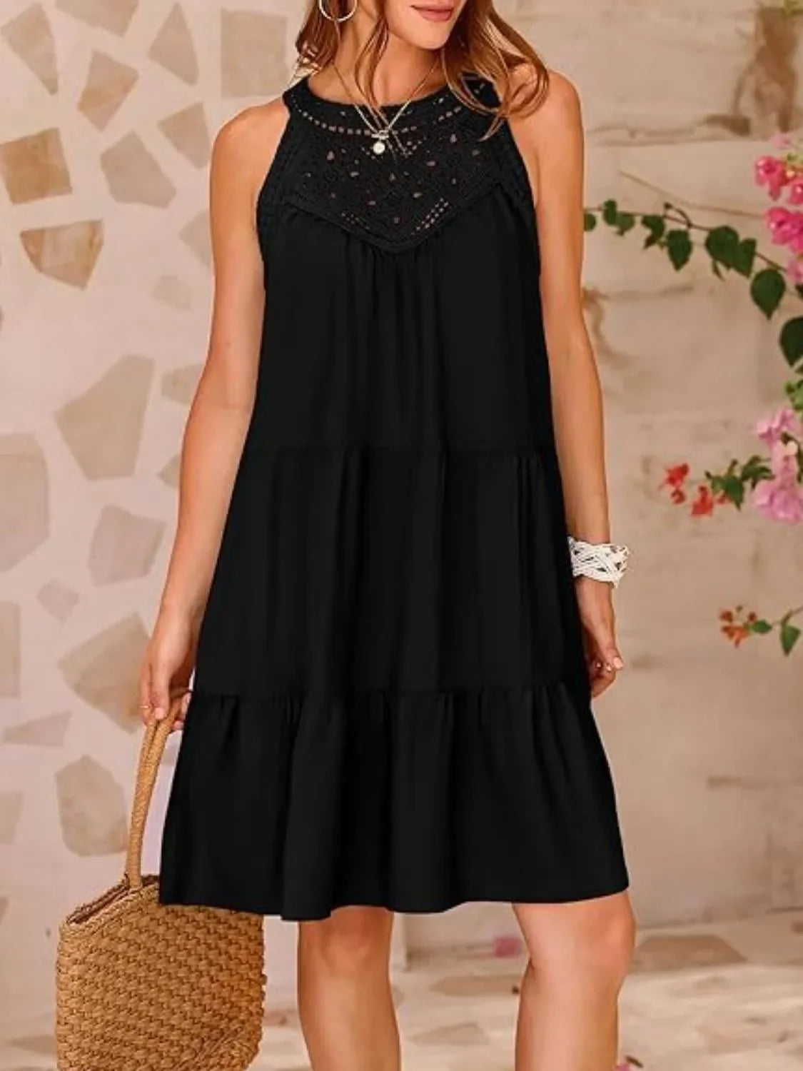 Black lace sleeveless dress with ruffled hem