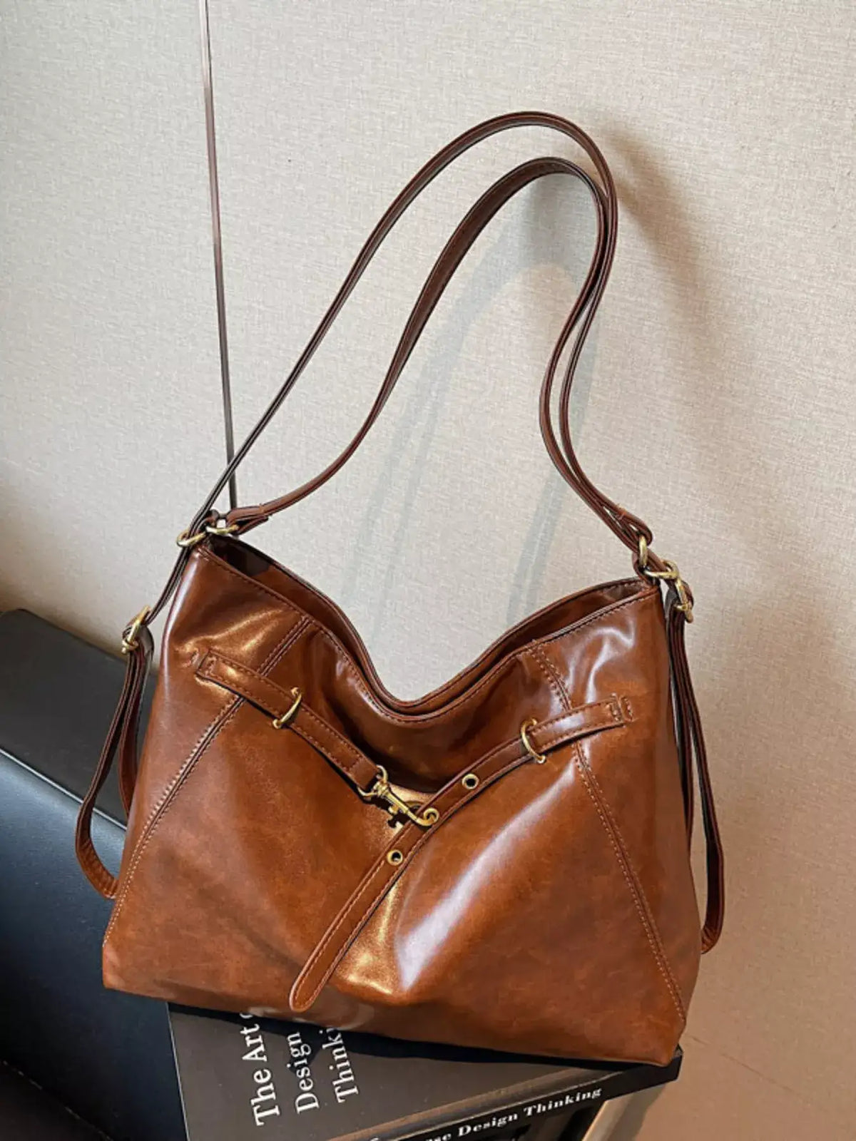 Brown vintage style PU leather crossbody bag from Evie's Dreamland with gold-tone hardware.