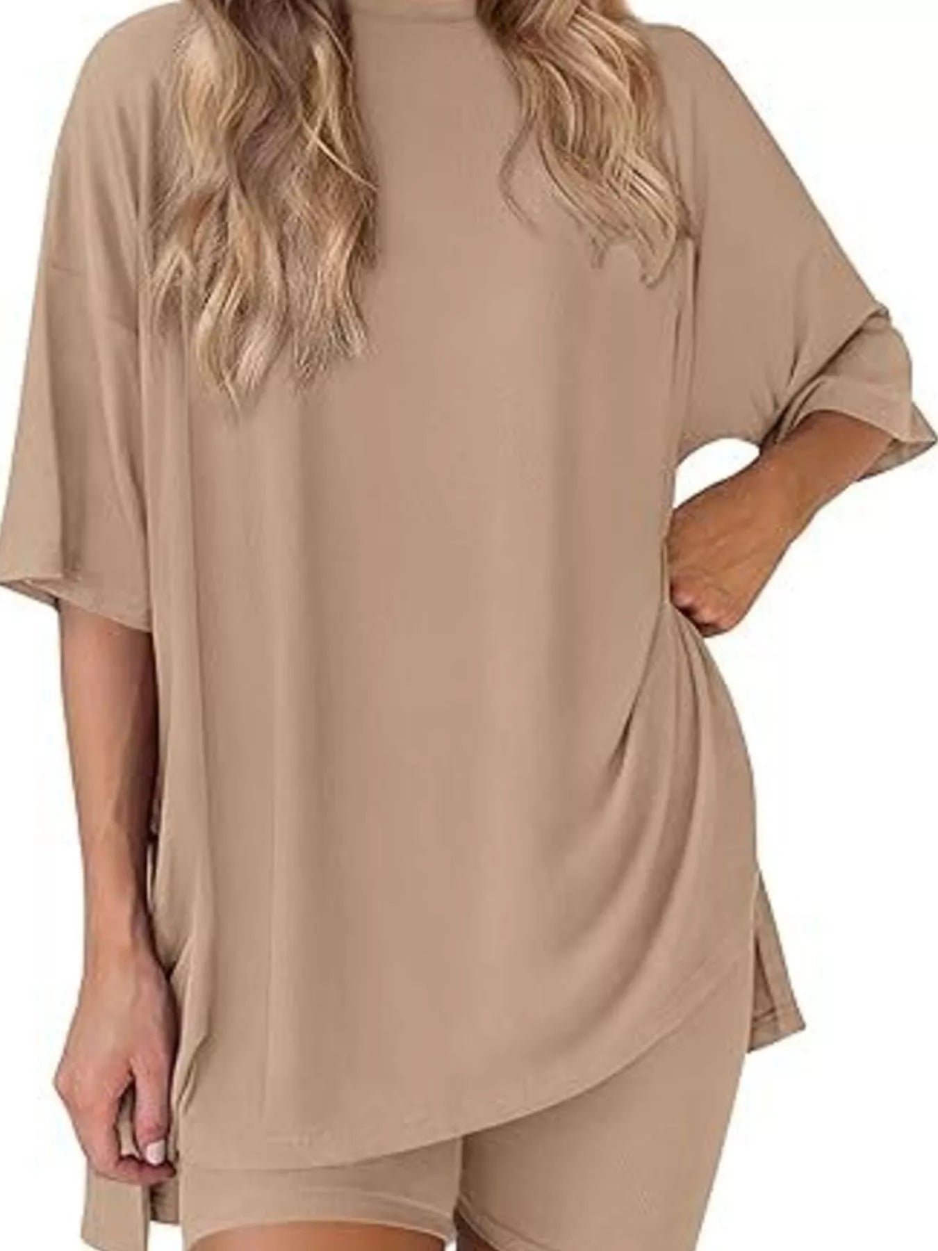 Woman wearing oversized beige lounge t-shirt and matching biker shorts set