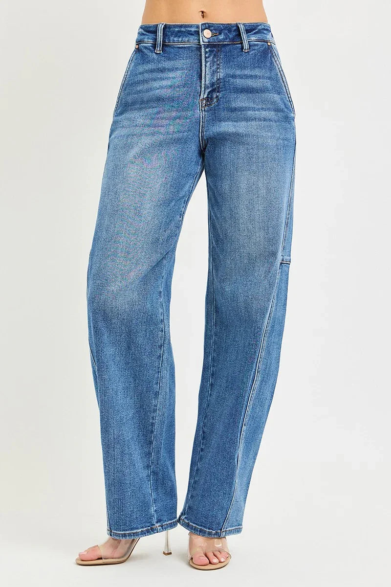 Women's high-waisted straight-leg blue jeans with front pockets and clear heeled sandals