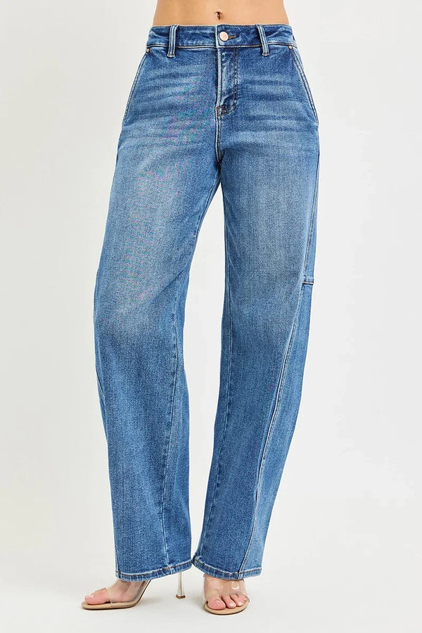 Women's high-waisted straight-leg blue jeans with front pockets and clear heeled sandals