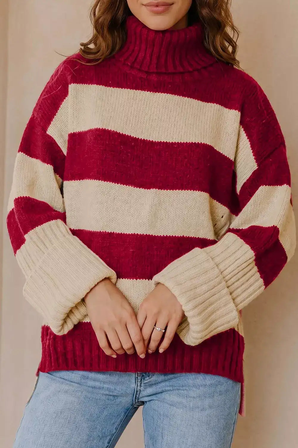 Evie's Dreamland red and beige striped turtleneck sweater with long sleeves and a relaxed fit.
