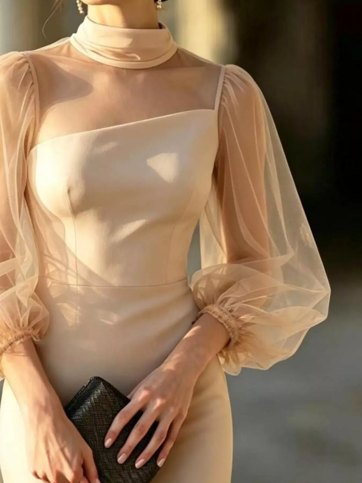 Evie's Dreamland beige bodycon dress featuring a mock neck and sheer puff sleeves.
