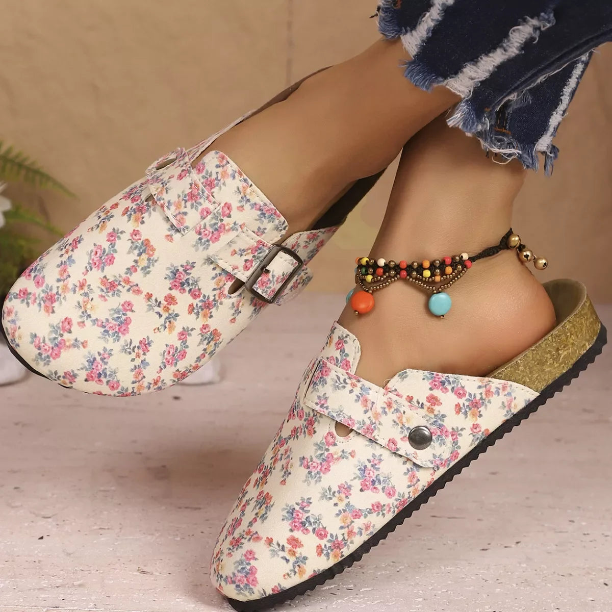 Women's pink floral print slip-on flats top view