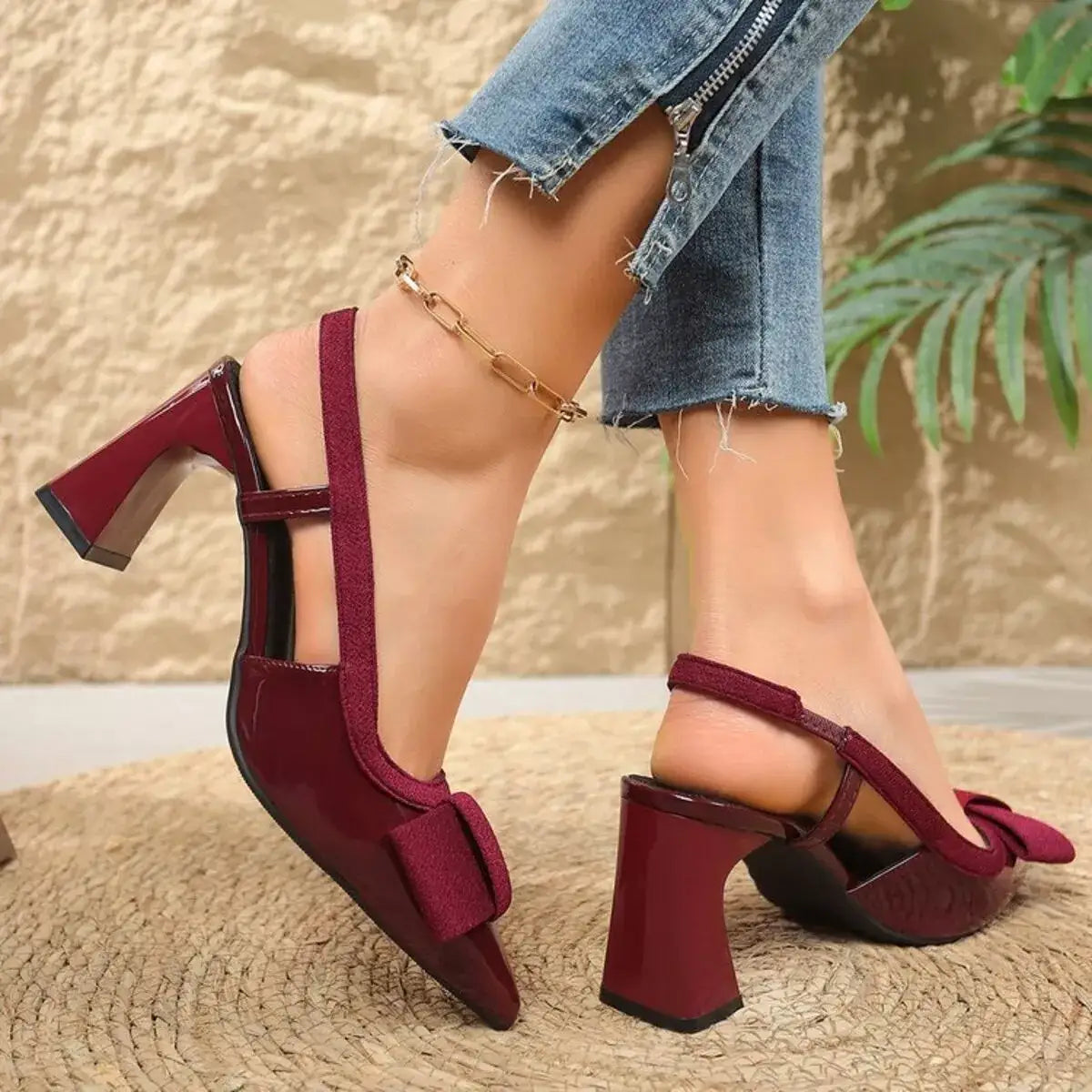 Burgundy pointed toe block heel slingback sandals by Evie's Dreamland with a bow detail and mid heel.