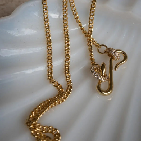Dainty cubic zirconia gold necklace close-up of pendant