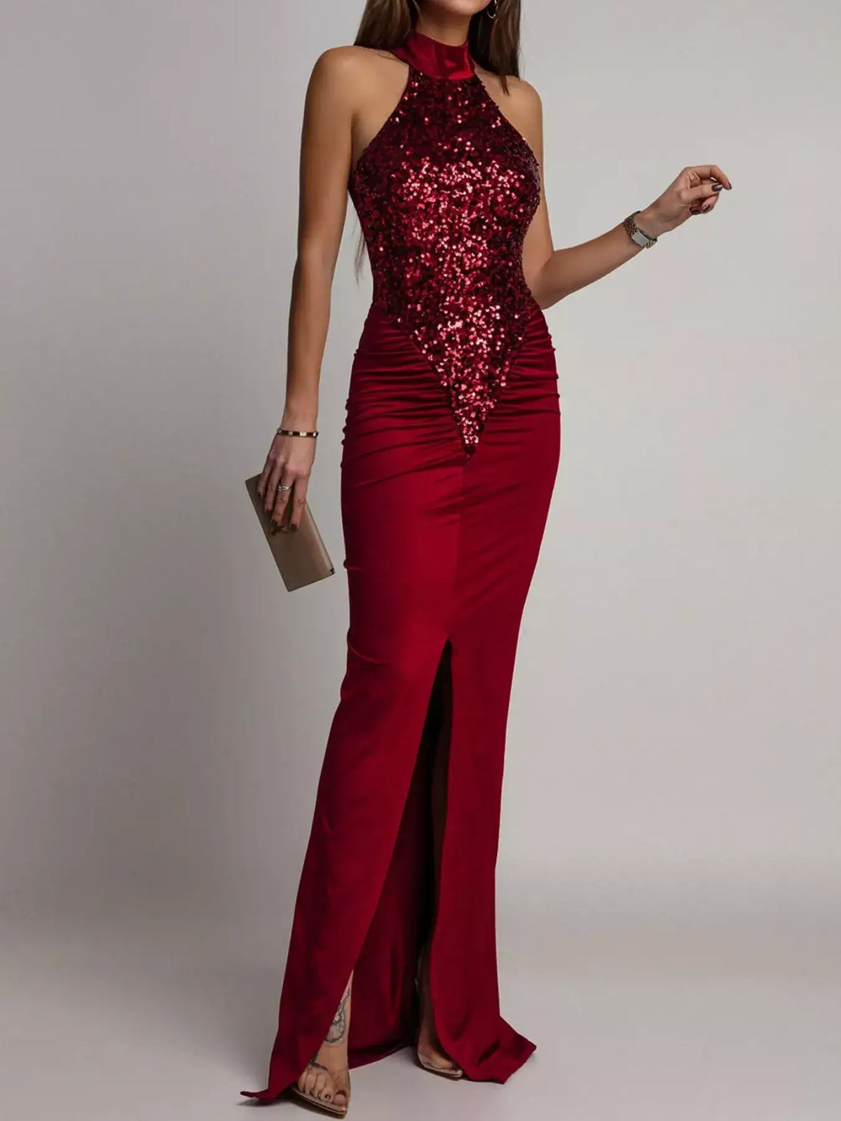 Evie's Dreamland red sequin halter maxi dress with a high slit and form-fitting silhouette.