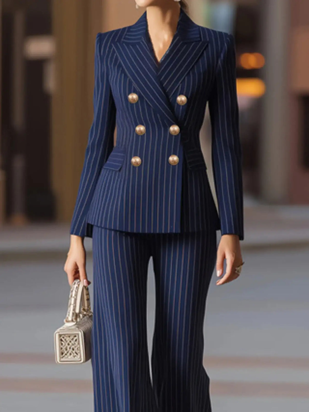 Navy blue pinstripe double-breasted blazer and wide-leg pants set by Evie's Dreamland.