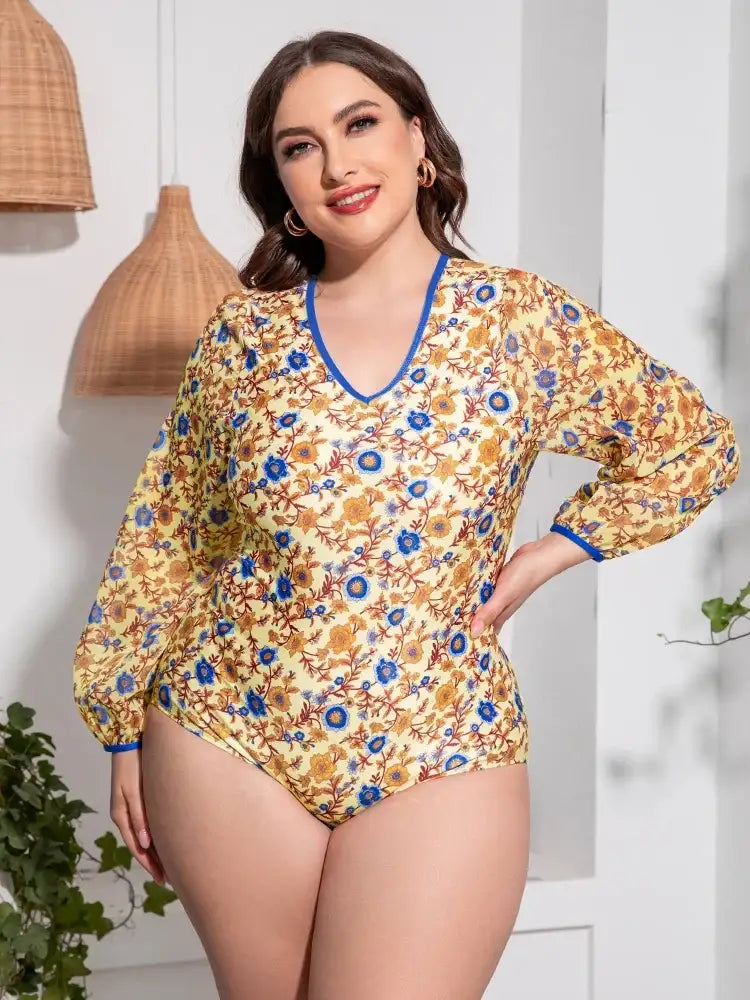 Plus size floral open back long sleeve one-piece swimsuit — women's V-neck bathing suit for the beach.