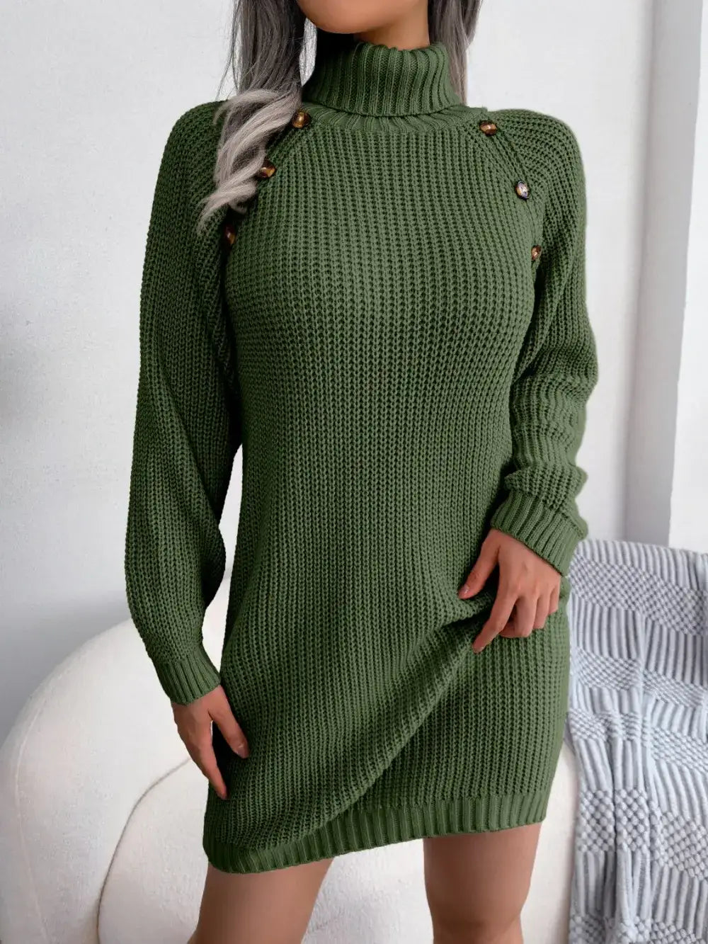 Olive green knit turtleneck sweater dress by Evie's Dreamland with decorative shoulder buttons.