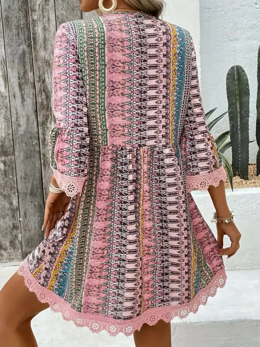 Woman wearing a boho printed lace-trim mini dress