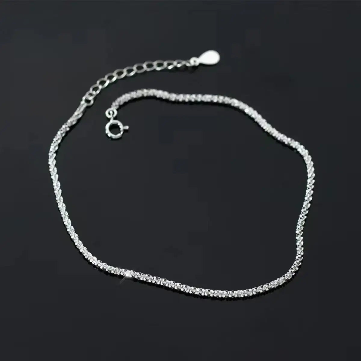 Evie's Dreamland 925 sterling silver adjustable chain bracelet for women on a dark background.