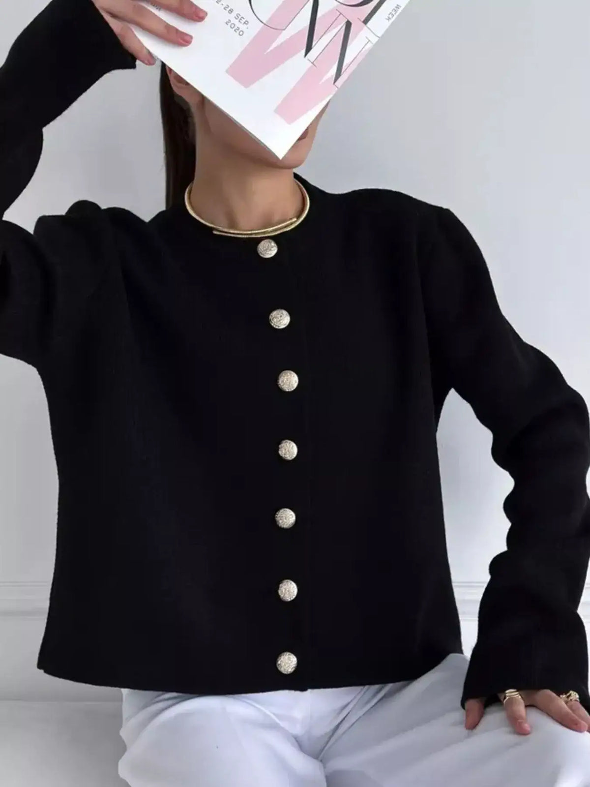 Evie's Dreamland black crew neck button down cardigan with gold buttons and long sleeves.