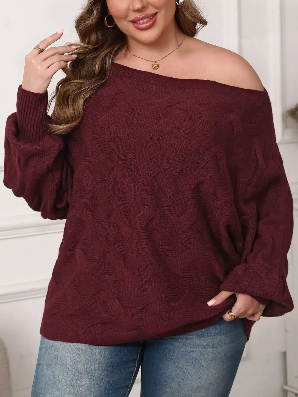 Plus size off-shoulder burgundy long sleeve sweater with a cable knit pattern by Evie's Dreamland.