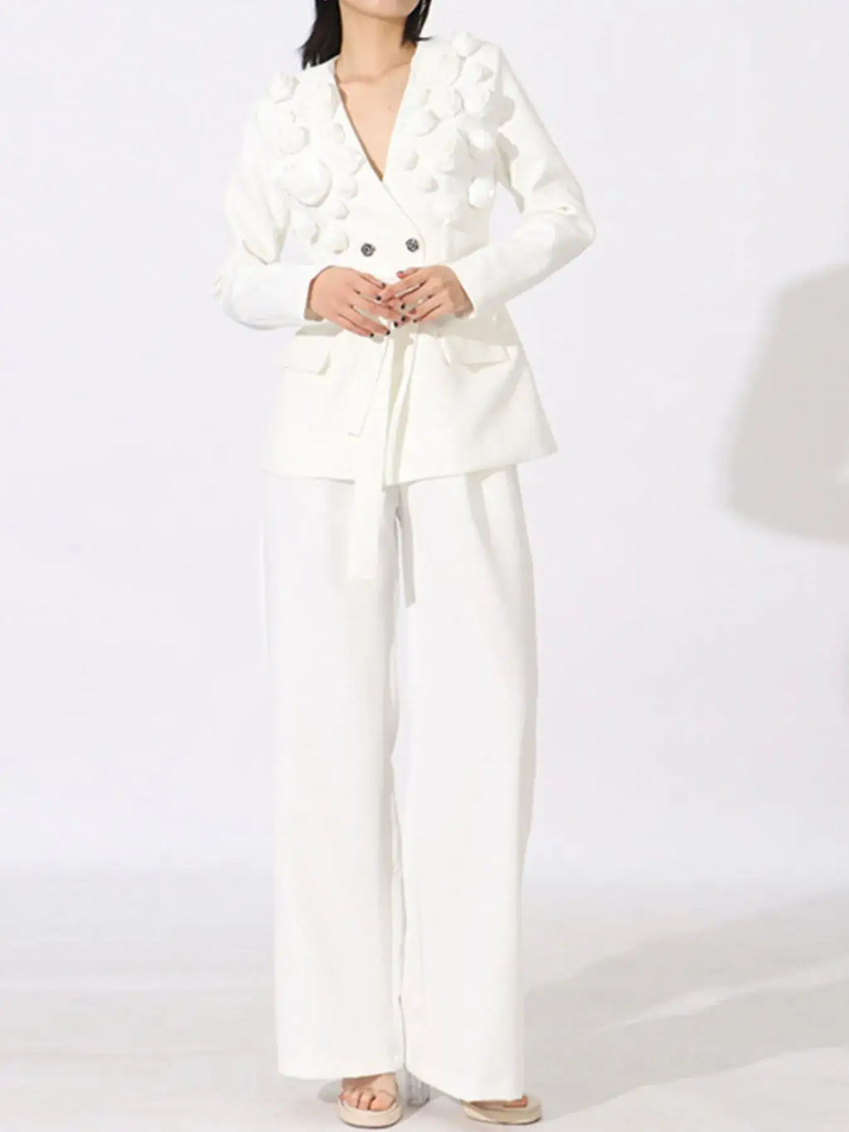 Evie's Dreamland white double-breasted blazer with floral appliqués and matching wide-leg pants.