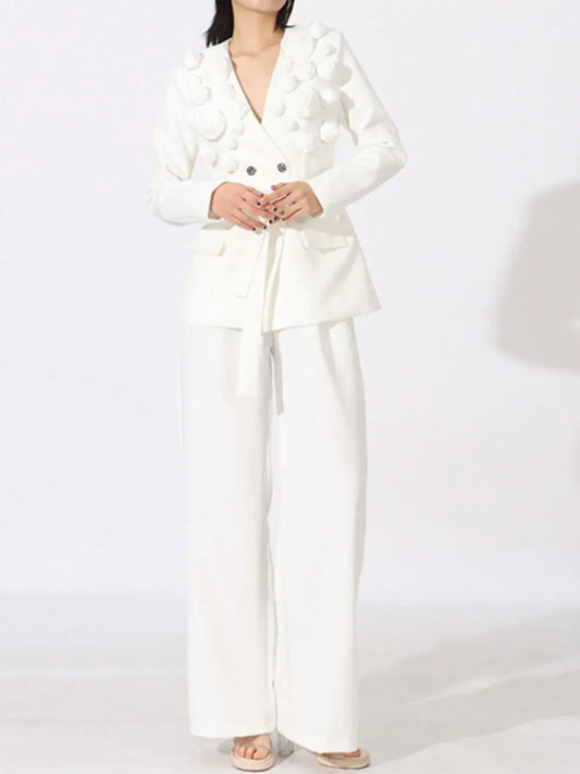 Evie's Dreamland white double-breasted blazer with floral appliqués and matching wide-leg pants.