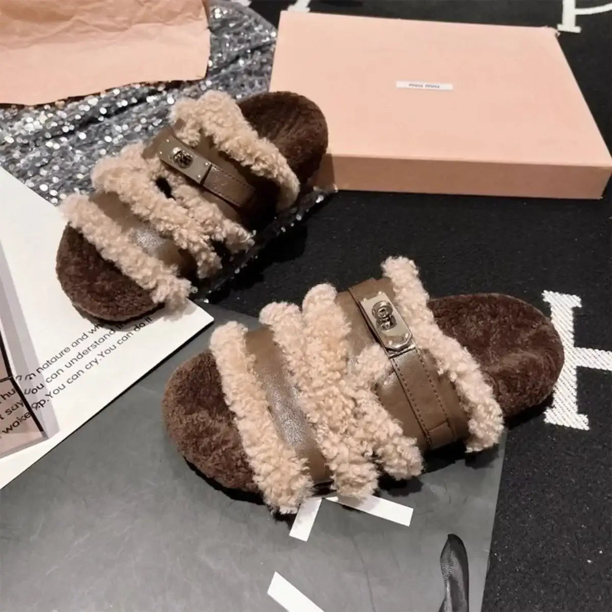 Brown faux fur buckle slippers by Evie's Dreamland with plush straps and cozy soles.