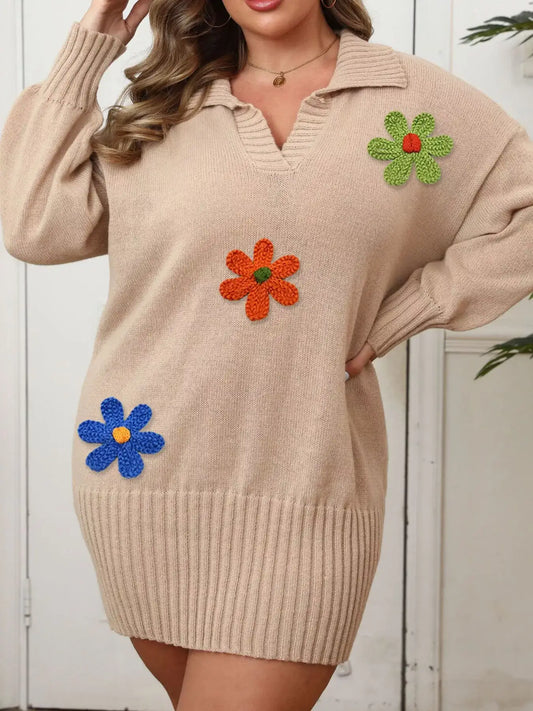 Beige plus size ribbed sweater dress by Evie's Dreamland with colorful floral appliqué and V-neckline.
