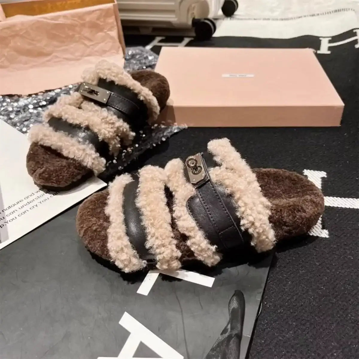 Brown and cream fuzzy buckle slippers by Evie's Dreamland featuring plush faux fur straps.