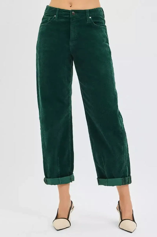 Woman wearing dark green corduroy pants with cuffed hems and beige slingback heels