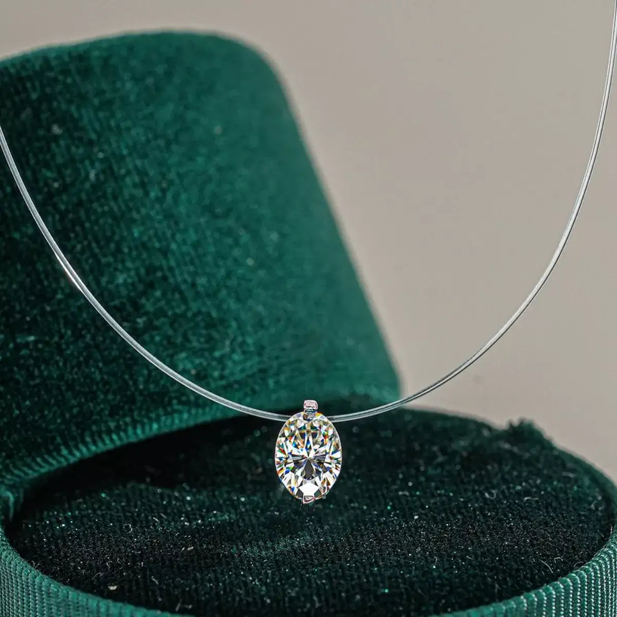 Evie's Dreamland oval moissanite pendant necklace in 925 sterling silver on a clear cord.