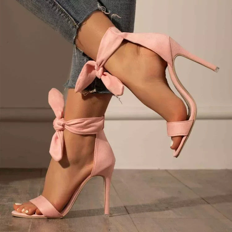 Close-up of stiletto heel on strappy open toe sandal