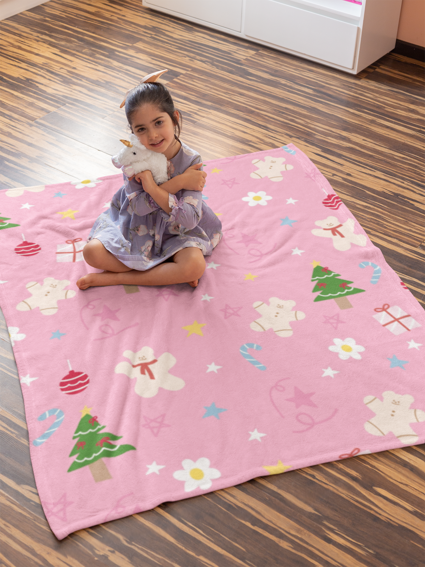 Close-up of luxurious Velveteen Plush Blanket with Christmas tree and candy cane design.

