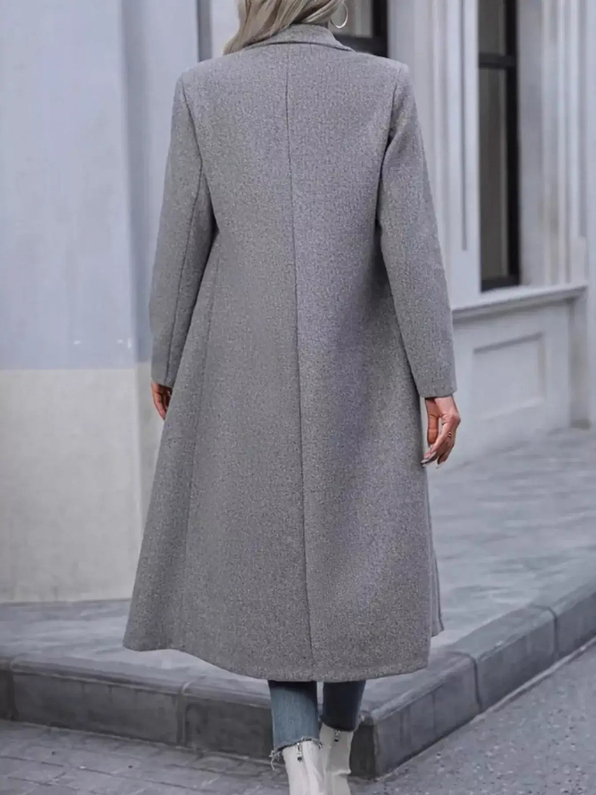 Back view of a grey longline double-breasted overcoat by Evie's Dreamland with a tailored fit.