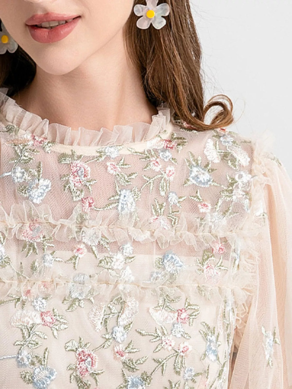 Woman in an apricot embroidered tulle maxi dress from Evie's Dreamland