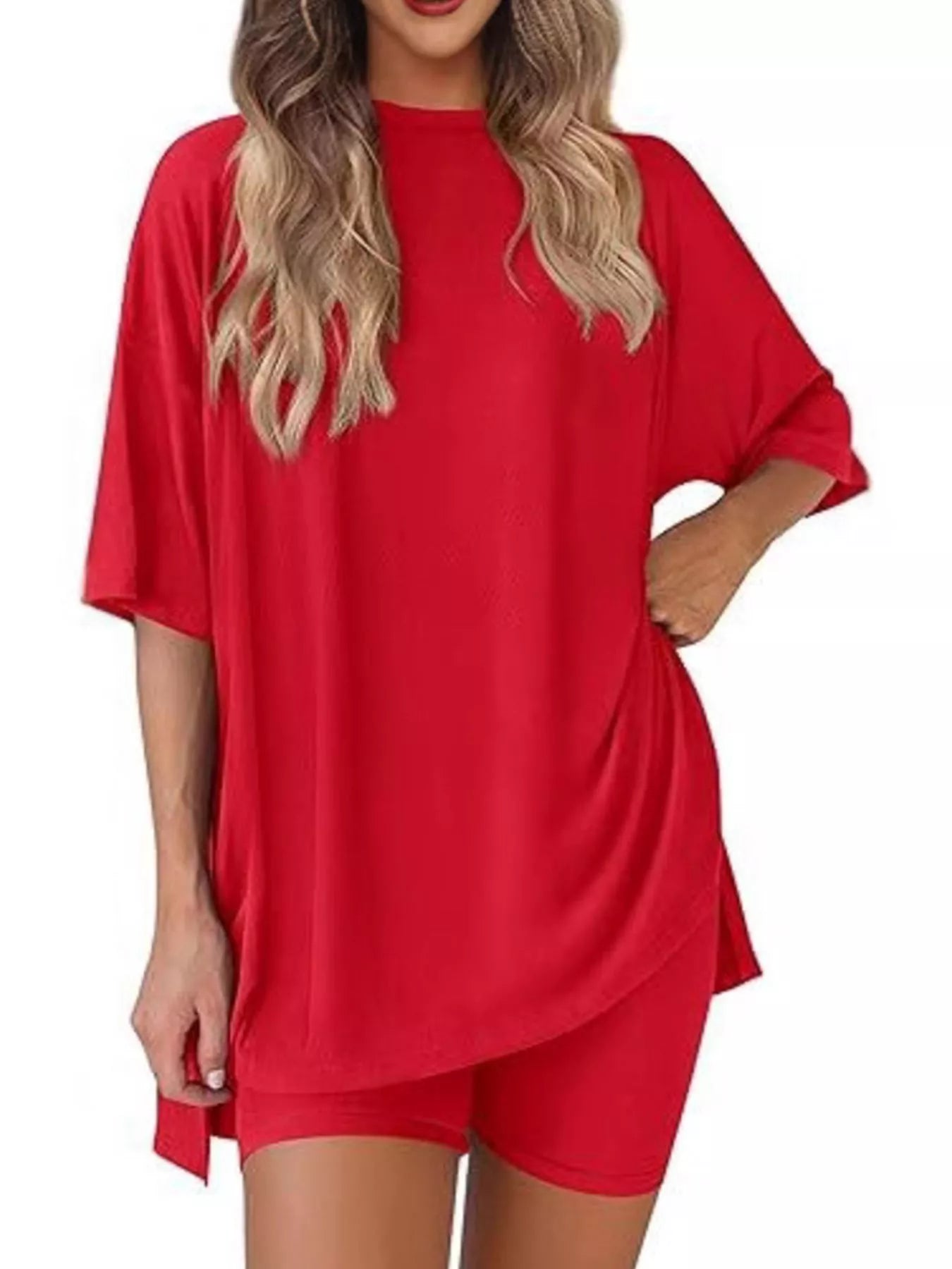 Woman wearing a loose red oversized t-shirt and matching red shorts set