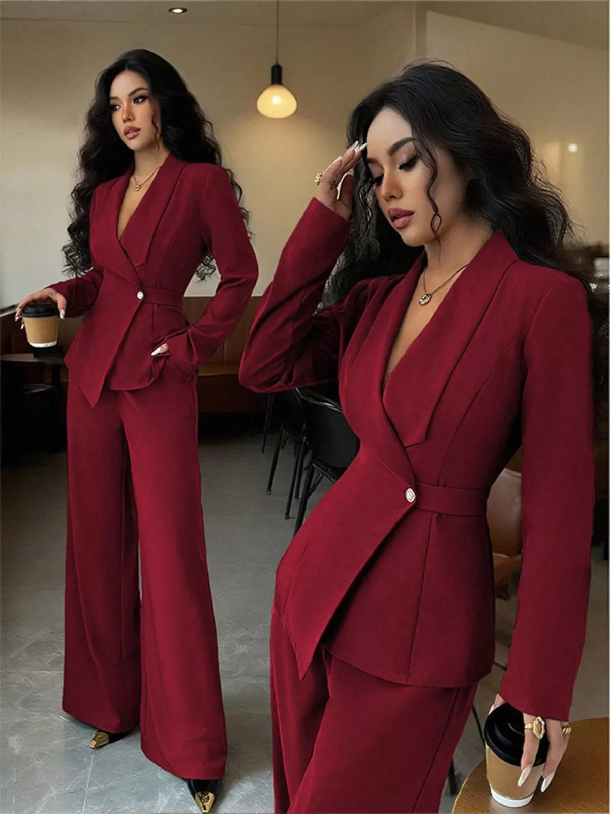 Woman in elegant burgundy pantsuit with wide-leg trousers, holding a coffee cup indoors