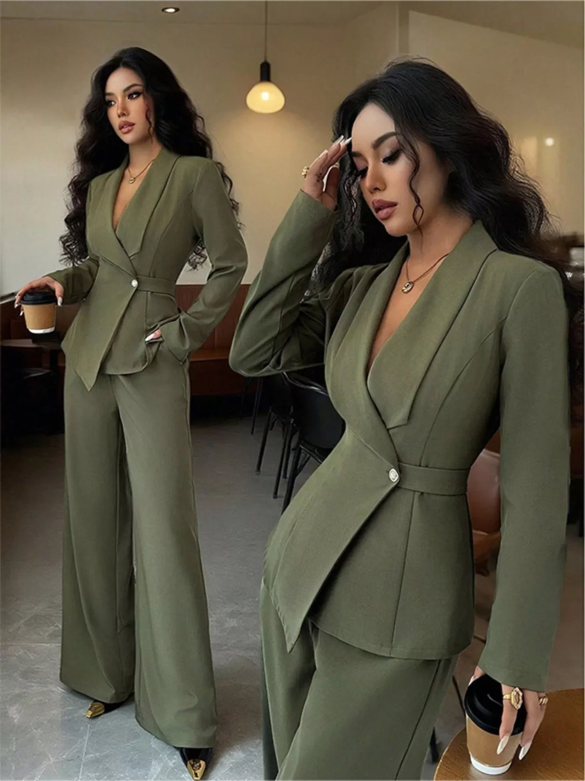 Woman in olive green tailored pantsuit with flared trousers, holding coffee in modern cafe