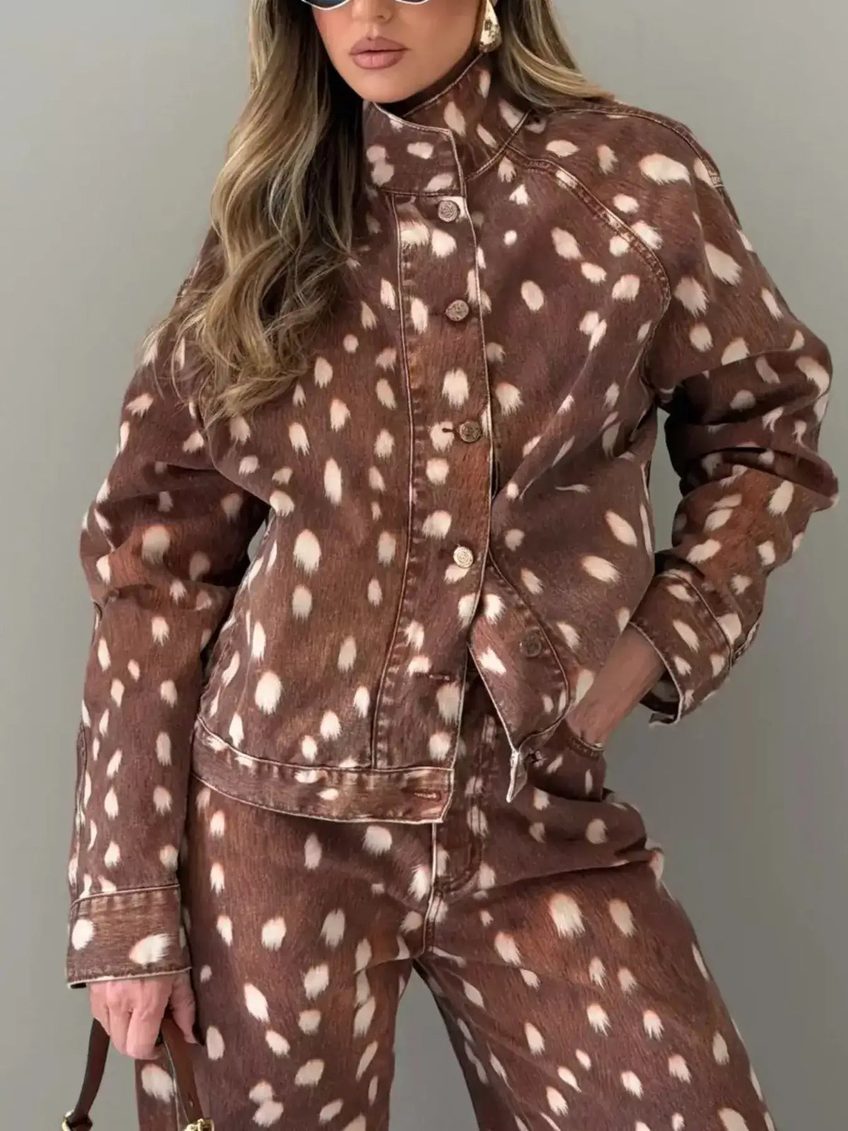 Woman wearing an Evie's Dreamland brown fawn-print button-down denim jacket and matching pants.