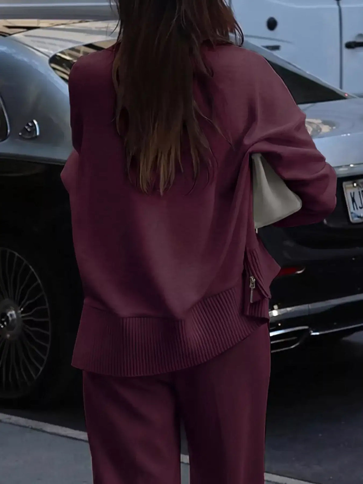 Back view of a burgundy ribbed sweatshirt and wide-leg pants set by Evie's Dreamland.