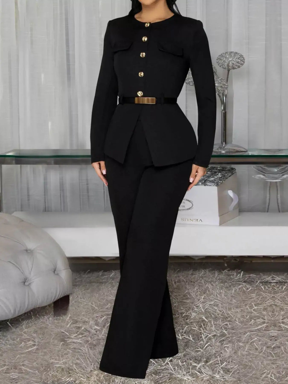 Evie's Dreamland black long sleeve button-up top with gold buttons and matching belted wide-leg pants.