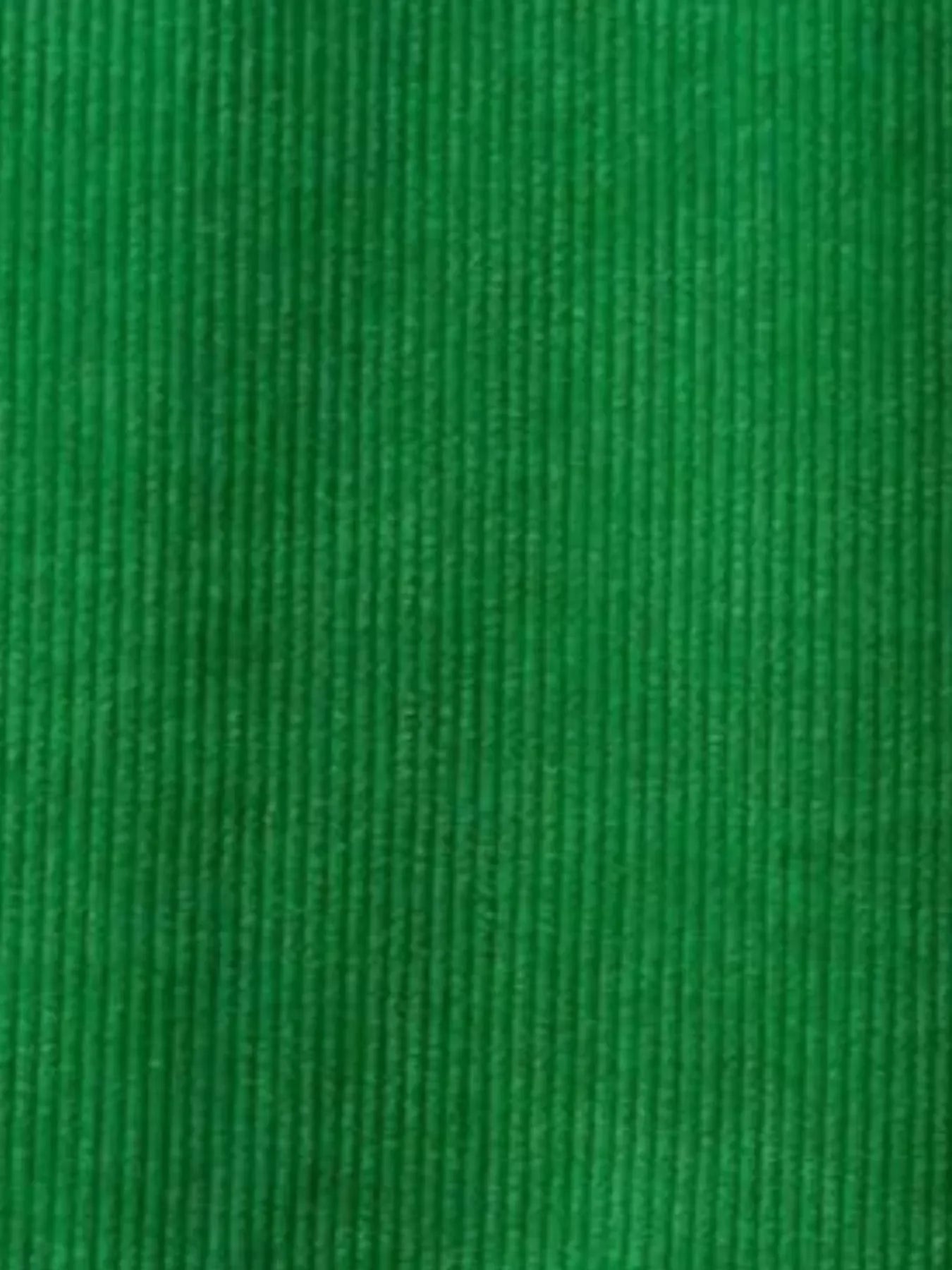 Close-up of green corduroy fabric texture with vertical ridges