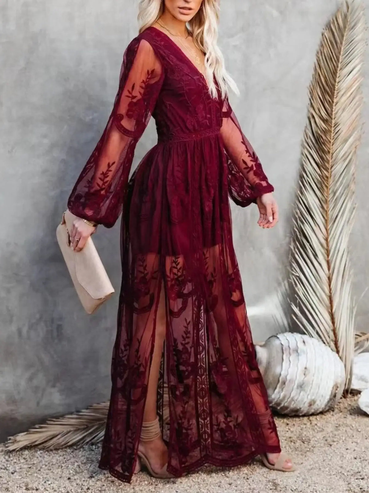 Woman wearing a floral lace slit maxi dress from Evie's Dreamland