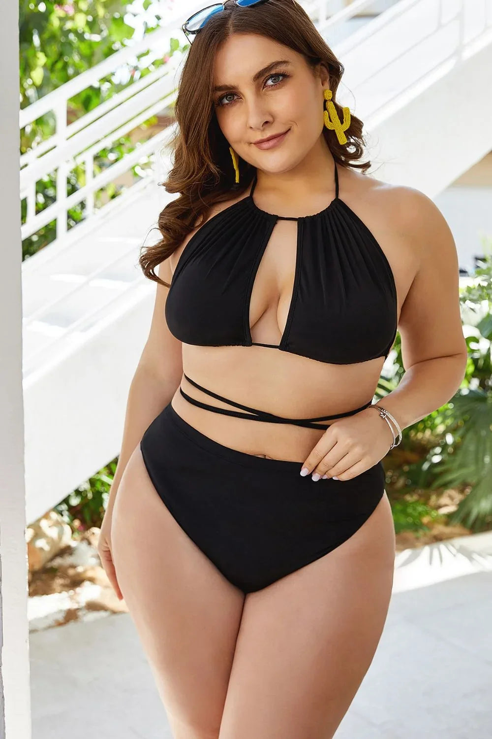 Full-length view of the plus size backless halter bikini set on a model.