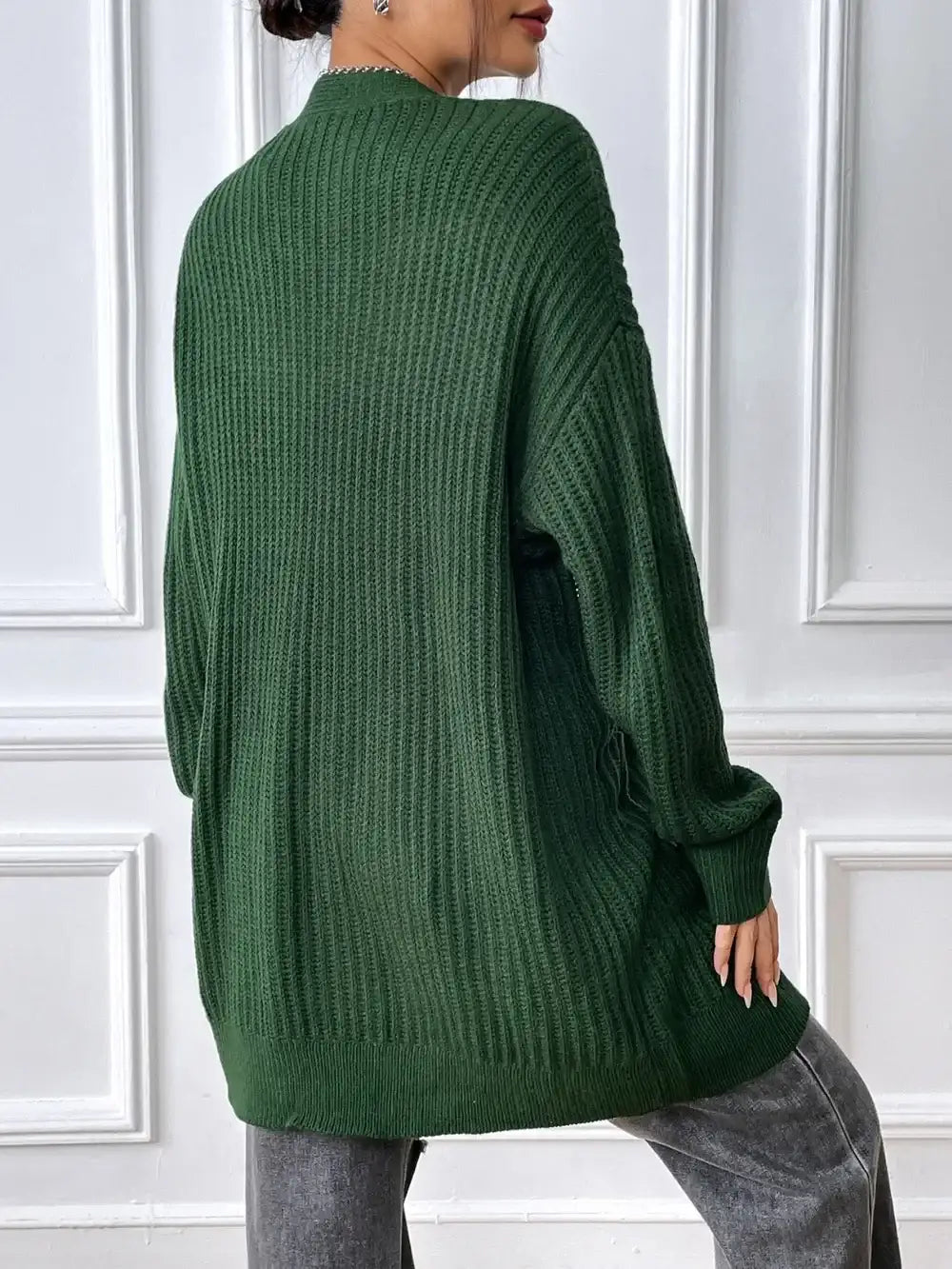 Back view of an Evie's Dreamland dark green ribbed knit open front cardigan with long sleeves.