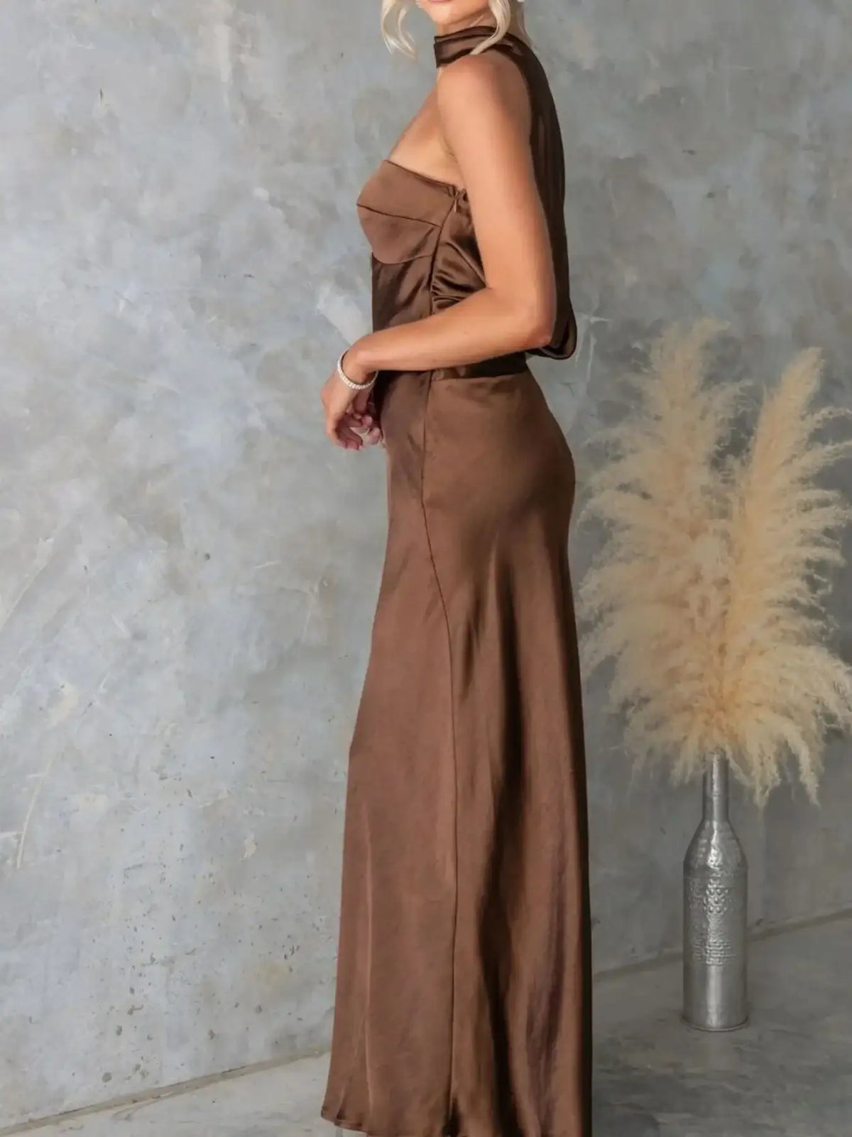 Side view of a brown satin tube maxi dress by Evie's Dreamland with a sleek fit and matching scarf.